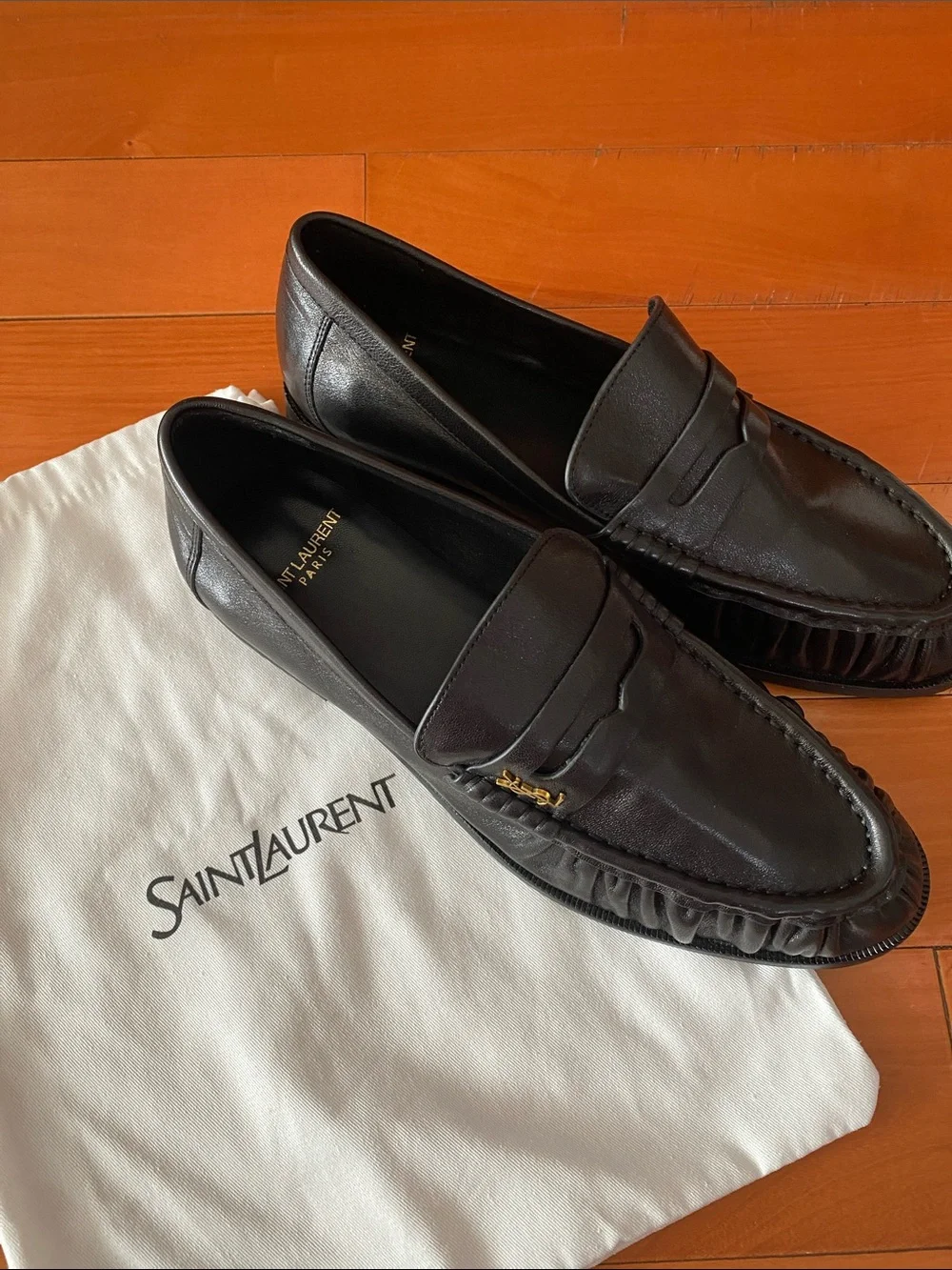 Saint Laurent Black Leather Penny Loafers with Gold Accent